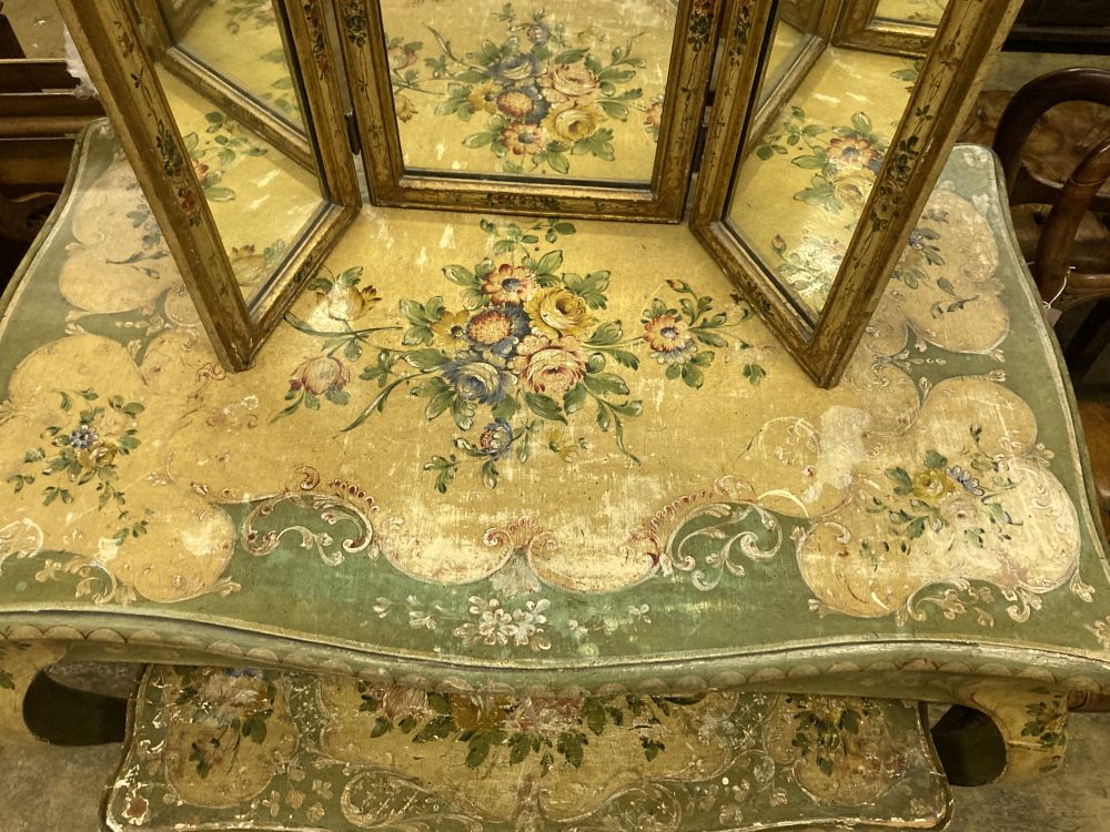 An early 20th century Venetian style rectangular floral painted serpentine table with similar triple dressing table and a low occasiona